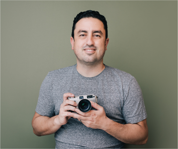 Kerem holding a camera